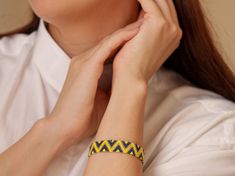 Brighten up your look with this handmade zigzag pattern bracelet, featuring Miyuki Delica beads in vibrant yellow and blue. The striking zigzag design adds a playful yet sophisticated touch to any outfit. The bracelet is crafted to a length of 16 cm (6.3 inches) with an extension chain, allowing it to fit wrists from 16 cm (6.3 inches) to 18 cm (7.1 inches). Perfect for adding a pop of color and style to your accessory collection. Materials: Miyuki Delica beads Waxed thread Features: Handmade wi Yellow Braided Friendship Bracelets, Handmade Yellow Friendship Bracelets, Yellow Friendship Bracelets With Round Beads, Yellow Friendship Bracelet, Delica Bracelet, Pattern Bracelet, Bracelet Miyuki, Zigzag Design, Miyuki Bracelet