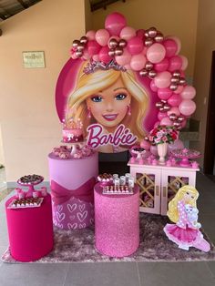 a barbie birthday party with balloons and decorations