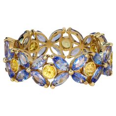 14k gold Eternity ring with sapphires and tanzanites. 14k solid gold Weight: 2.80 gr- depends from size Set with sapphires Round shape, yellow color, aprx 0.64 ct total (8 pieces - 0.08 ct each) Clarity: SI Tanzanite: Marquise shape, blue color, VS clarity, (32 pieces x 0.12 ct) total 3.84 ct Memory Ring, Eternity Ring Set, Gold Eternity Ring, Chain Ring Gold, Sapphire Engagement Rings, Eternity Ring Gold, Full Eternity Ring, Half Eternity Ring, Rings Engagement