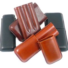 four pieces of leather sitting on top of each other