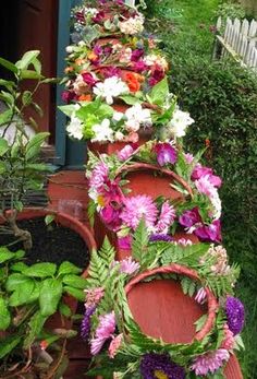 a row of flower pots sitting next to each other