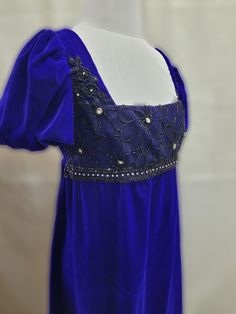 This dress has free standard shipping included!  Standard shipping Air Mail, no tracking.  If you would like Express Post or place by place tracking, please contact us, and we can set that up for you!   We offer a basic Regency styled gown, with the empire waist and short puffed sleeves.  This dress is made with a deep purple velvet, with a beaded black beaded lace trim on the bodice front.    *This gown ties at the back with ribbons which can adjust the fit.      * All seams have been finished Blue Regency Dress, Bridgerton Daphne, Jane Austen Emma, Regency Gown, Regency Dress, Womens Costumes, Purple Velvet, Women's Costumes, Pride And Prejudice