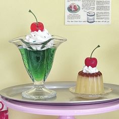 two desserts sitting on top of a table next to a box of jello