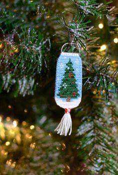 a christmas ornament hanging from a tree