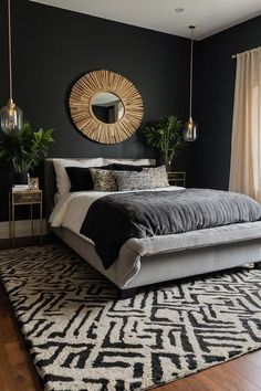 a bedroom with black walls, white and gray bedding, gold accents and mirrors on the wall