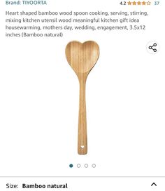 a wooden spoon with a heart shaped bamboo spoon on it's side and the words,