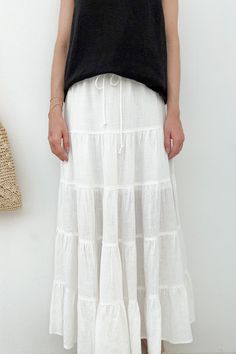 Just what you need for your next getaway! The effortless Wade Linen Tiered Maxi Skirt is made of a lightweight mixed linen fabric that can easily be dressed up or dressed down! Featuring elastic drawstring waist, lining throughout, white color, mixed linen fabric, maxi length, tiered fabric and a true to size fit. Style this skirt with simple tank top, dainty necklaces and a neutral bag! Details & Sizing Elastic drawstring waist Lining throughout White color Mixed linen fabric Maxi length Tiered Neutral Bag, Simple Tank Tops, Skirt Linen, Dainty Necklaces, Tiered Maxi Skirt, Bag Details, Sweater Set, Fit Style, Dressed Down