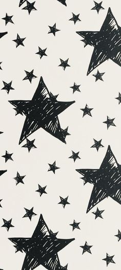 black and white drawing of stars flying in the air with one being drawn on it