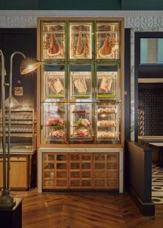 a display case with meats and other foods in it