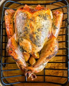 a whole chicken sitting on top of an oven rack