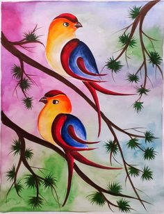 two colorful birds sitting on top of a tree branch