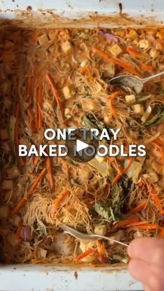 someone is spooning food out of a baking dish with the words, one tray baked noodles