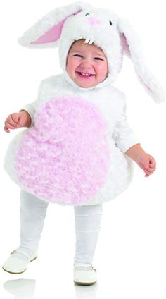 a baby dressed in a bunny costume with a pink heart on it's chest