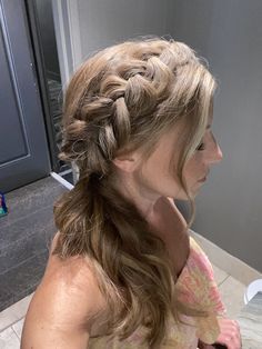 a woman with long hair in a braid