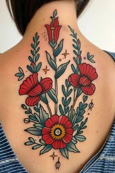 a woman's neck with red flowers and leaves on the back of her body