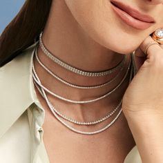 As seen on THE Taylor Swift. This delicate diamond tennis choker is a modern take on the traditional tennis necklace. Bonus: the piece can be worn doubled as a bracelet! Available in 14K Rose Gold Diamond weight = 3.60 carats Each stone is 0.03 carats Diamond quality is G-H, SI2 Necklace = 10.75in of diamonds with 3in of adjustable rings See our Size Guide for more information Lobster claw closure Please contact us for custom length options This item is FINAL SALE Diamond Cocktail Rings, Tennis Necklace, Band Bracelet, Diamond Shop, Earring Sale, Bracelet Collection, Rose Gold Diamonds, Earrings Collection, Diamond Bands