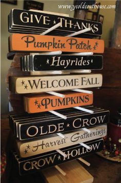 a stack of books sitting on top of a wooden table