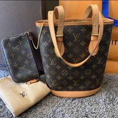 Overall In Great Condition Lv Monogram Canvas Petit Bucket (Pm) With Accessories Removable Lv Classic Monogram Pouch.. Bucket Interior Looks Like Not Used. Very Clean Inside Only 1 Little Dot Almost Not Visible. Hardware Still Very Gold. Exterior Canvas In Awesome Condition. Showing Little Sign Of Wear. Light Discoloration On The Leather Part. Same Date Code For Bucket Bag And Pouch. ***Pouch Has Rivets Attachment For Wristlet Or Crossbody. See Photos For Condition. Patina On The Leather Part An Classic Monogram, Lv Monogram, Only 1, Rivets, Monogram Canvas, Louis Vuitton Monogram, Louis Vuitton Bag, Bucket Bag, Patina