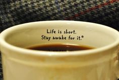 a coffee cup with the words life is short, stay awake for it