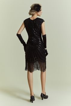 This elegant dress is classic vintage look for a modern woman. The eyecatching design features art deco print and unique vintage style which bring you back to the roaring twenties. Features: Crew neck Back?zipper closure Below the knee Glittering beads 1920s Beaded Fringe Fitted Flapper Dress, 1920s Fitted Flapper Dress With Beaded Fringe, Fitted Embellished Flapper Dress, Embellished Fitted Flapper Dress For Costume Party, 1920s Embellished Fitted Flapper Dress, 1920s Embellished Flapper Dress, Fitted Art Deco Flapper Dress For Costume Party, Fitted Beaded Fringe Flapper Dress For Costume Party, Fitted Flapper Dress With Beaded Fringe For Costume Party