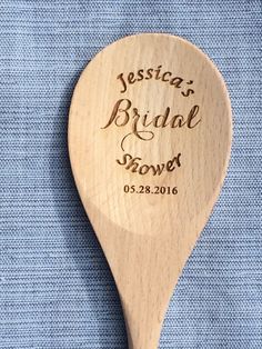 a wooden spoon with the words jesus's bridal power engraved on it, sitting on a blue cloth