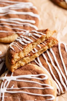 some cookies with white icing are on a table