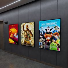 there are three movie posters on the wall