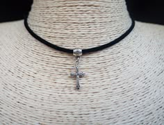 "Cross Necklace Pendant Choker Cord Necklace Religious Jewelry Christian Necklace Black Suede Necklace Unisex Necklace ~ A boho necklace with metal pendant. ~ Black colour cord, 12\" shortest length. ~ Clasp and 1\" extender chain to adjust to you. ~ Made with the utmost care to enjoy it as long as possible. All jewelries are are in stock and ready to be shipped within 1-2 business day from ordering to dispatch. Please note these times increase during Christmas & busy periods. 🌍 SHIPPING & DELI Adjustable Cross Necklace For Festivals, Vintage Adjustable Cross Pendant Necklace, Adjustable Vintage Cross Pendant Necklace, Adjustable Cross Pendant Jewelry, Adjustable Metal Charm Necklaces For Festivals, Adjustable Cross Necklace With Lobster Clasp, Adjustable Cross Jewelry With Cord, Adjustable Cross Necklace With Cord, Adjustable Black Necklace With Charms