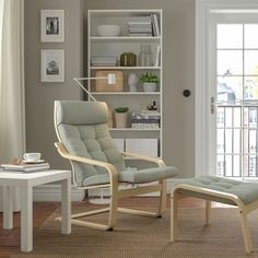 a living room with a chair and ottoman