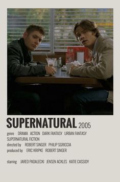 two men sitting at a table in front of a window with the words supernatural on it