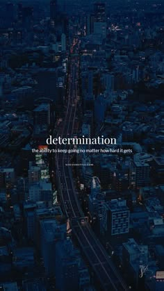 an aerial view of a city at night with the words determination written in white on it