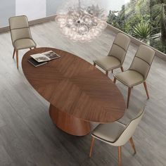 an oval dining table with four chairs around it