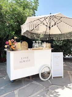 an ice cream cart is decorated with flowers