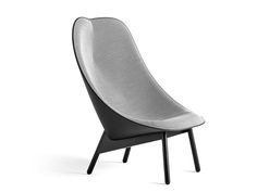 a black and white chair with an upholstered back rest on it's legs