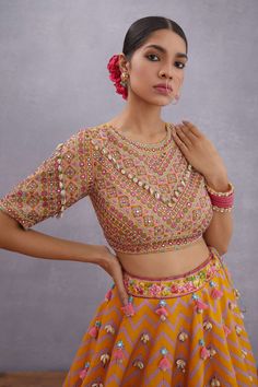 Editor's Note Featuring Yellow Sunehra Aoruni Lehenga Set Color: Topaz Yellow Fabric: Thin Handwoven Chanderi, Pure Cotton Silk  Component: Lehenga, blouse and dupatta Occasion: Haldi mehndi an... Kaudi Shell Blouse, Kaudi Shell Dress, Kaudi Shell Blouse Design, Heavy Blouses, Embroidery Kurtis, Indian Mythology, Haldi Outfits, Indian Outfits Lehenga, Topaz Yellow