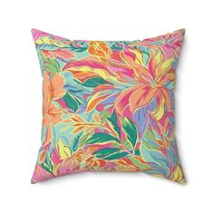 a colorful floral pillow on a white background