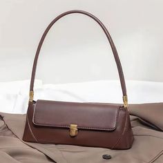 SPECIFICATIONSBrand Name: YogodlnsHandbags Type: Shoulder BagsTypes of bags: Shoulder & Crossbody BagsMain Material: PULining Material: PolyesterShape: BaguettePlace Of Origin: GUANG DONG ProvincePlace Of Origin: GUANG DONG ProvinceOrigin: Mainland ChinaCN: GuangdongHardness: SOFTPattern Type: SolidInterior: No PocketDecoration: NONEExterior: NONEOccasion: VersatileClosure Type: zipperGender: WOMENStyle: fashionNumber of Handles/Straps: SingleShoulder Bag: PU Leather Shoulder BagWomen Bag: Vintage Crossbody BagHandbag: Simple Solid Color PurseChoice: yessemi_Choice: yes Large Capacity Formal Satchel Baguette Bag, Formal Large Capacity Baguette Satchel Bag, Office Baguette Bag With Top Handle For Mobile Phone, Formal Large Capacity Satchel Baguette Bag, Office Top Handle Baguette Mobile Phone Bag, Formal Double Handle Baguette Bag With Large Capacity, Daily Use Clutch Baguette Bag With Large Capacity, Classic Handheld Baguette Bag For Office, Handheld Baguette Bag With Detachable Handle For Office