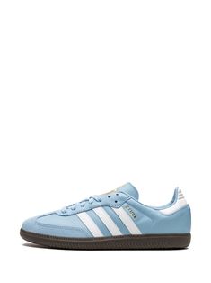 Find ADIDAS Samba Team Argentina Sneakers on Editorialist. light blue/white signature 3-Stripes logo logo print to the side round toe front lace-up fastening logo-print tongue contrasting heel counter gum-rubber sole These styles are supplied by a premium sneaker marketplace. Stocking only the most sought-after footwear, they source and curate some of the most hard to find sneakers from around the world. Light Blue Adidas Shoes, Blue Skate Shoes With Three Stripes And Round Toe, Blue Three Stripes Skate Shoes With Round Toe, Adidas Running Sneakers With Contrast Sole, Adidas Sneakers With Contrast Sole For Running, Blue Low-top Sneakers With Three Stripes, Blue Sporty Sneakers With Three Stripes, Blue Streetwear Sneakers With Three Stripes, Low-top Three Stripes Running Sneakers