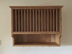 a wooden shelf hanging from the side of a wall