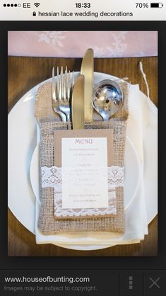 a table setting with silverware and napkins