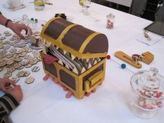 a table topped with lots of different types of cookies and other items on top of it