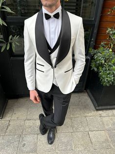 Color: white Material: 65% polyester, 35% viscose Suit includes blazer, waistcoat & trousers Single-breasted suit (1 button blazer) Lapel type: shawl lapels Jacket interior lining option: fully-lined Jacket vent: double vent Fitting: slim-fit Care instructions: dry clean only Machine washable: no