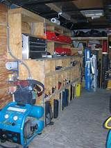 the inside of a garage with various tools and equipment on shelves next to each other