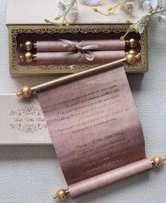 the wedding stationery is laid out in a box