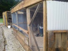 an outdoor chicken coop with the door open