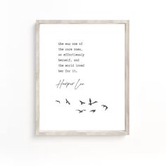 a white framed print with birds flying in the sky and an inspirational quote above it that reads, she was one of the most