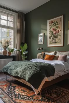 Cozy sage green bedroom featuring elegant decor, botanical art, and a mix of warm textiles. Ideal inspiration for a calming retreat. Green Bedroom Eclectic, Dark Green Duvet Bedroom, Sage Black Bedroom, Sage Green Bedroom Dark Wood, Olive Green Guest Bedroom, Cottage Bedroom Green, Bedroom With Dark Green Accent Wall, Cosy Warm Bedroom Aesthetic, Green Bed Frame Bedroom Ideas