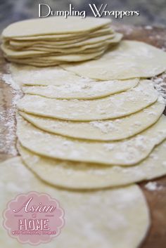 homemade dumpling wrappers are stacked on top of each other and ready to be put in the oven