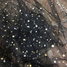 black and gold stars on sheer fabric