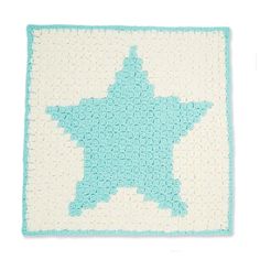 a crocheted blanket with a blue star on it